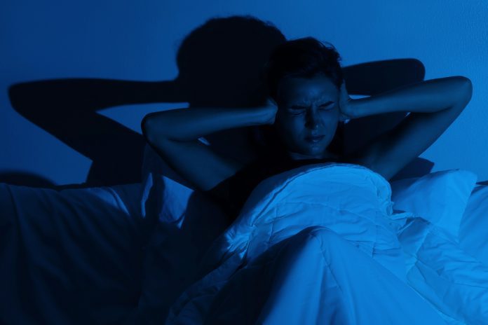 Woman with insomnia because of loud noises