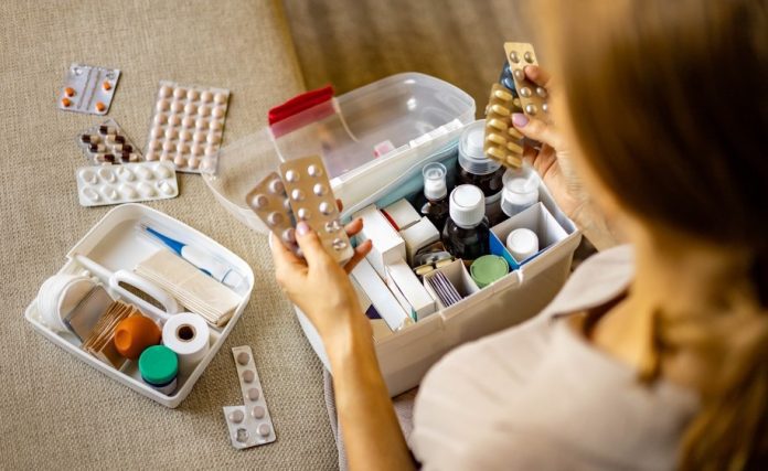 Closeup,Female,Hand,Neatly,Placing,Medicament,At,Domestic,First,Aid