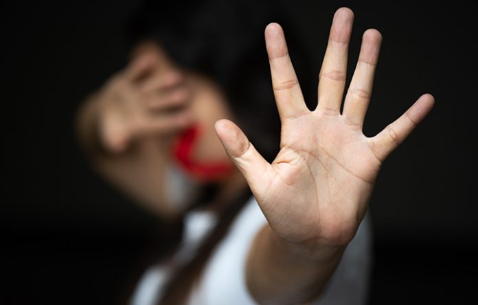 Woman hand sign for stop and wrapping her mount, abusing violenc